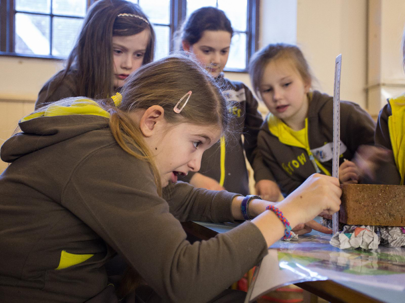 Girl guides partaking in STEM activities. 