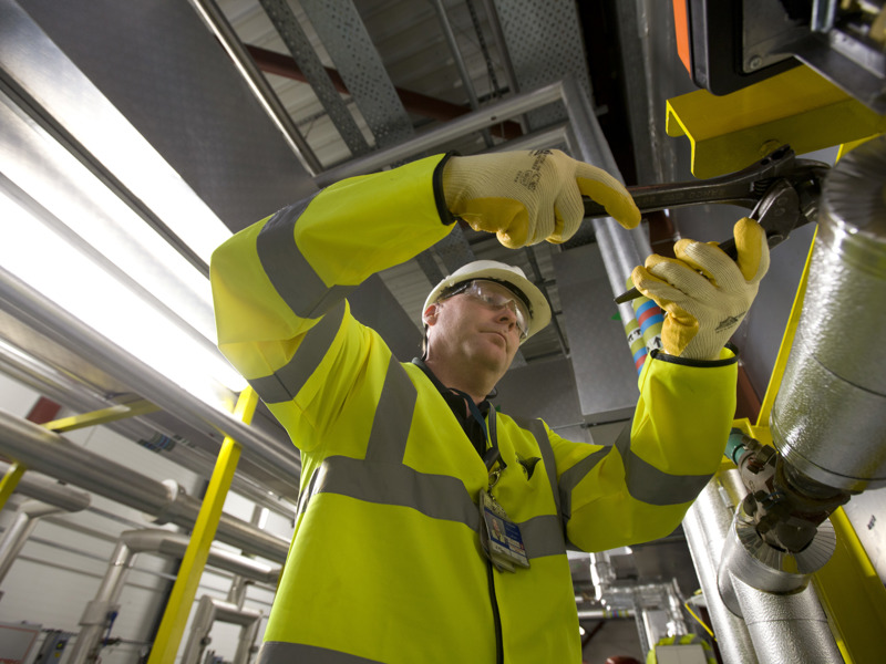 Image of a man carrying out work in a boiler room.