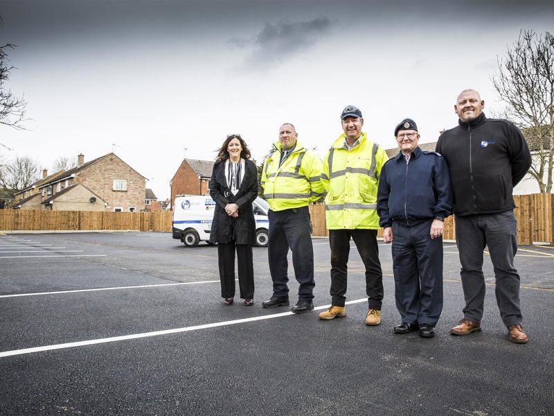 Amey and DIO personnel in a car park they have just refurbished.