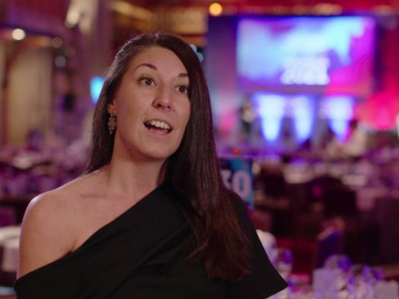 Image of a woman in formal attire.