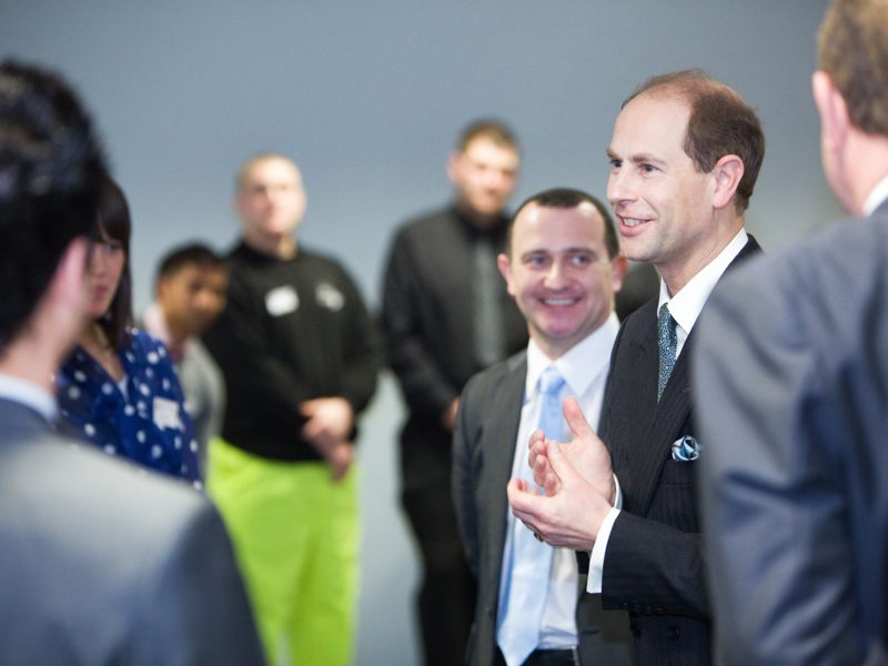 A small gathering of people chatting.