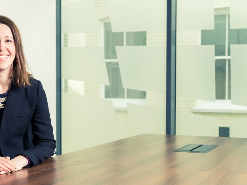 Photograph of Sam Sawyer at a desk.