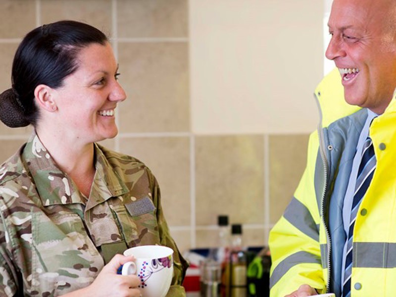 military personnel and Amey employee in PPE.