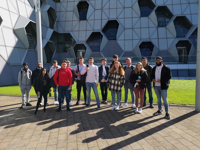 A group of people stood on a path.