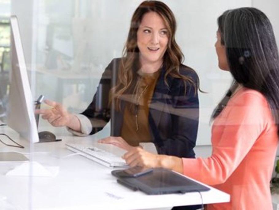 Two woman working at a desk