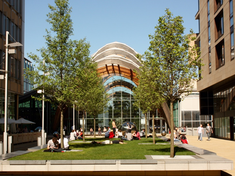 A building with an area of grass outside.