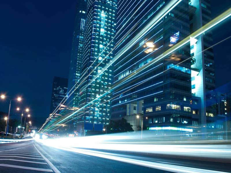 A cityscape image of a high rise building,