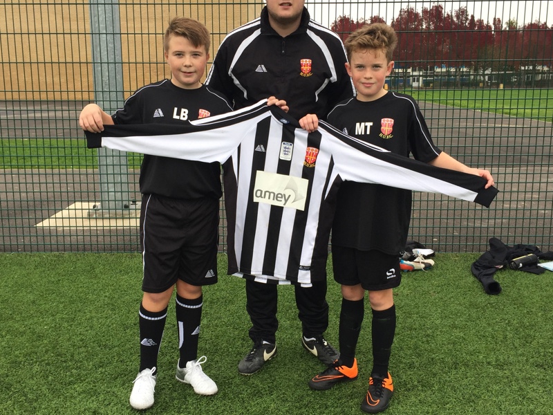 A image of football team members showing their new Amey sponsored kit.