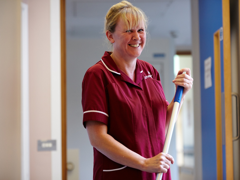a female Amey employee, cleaning the floor.