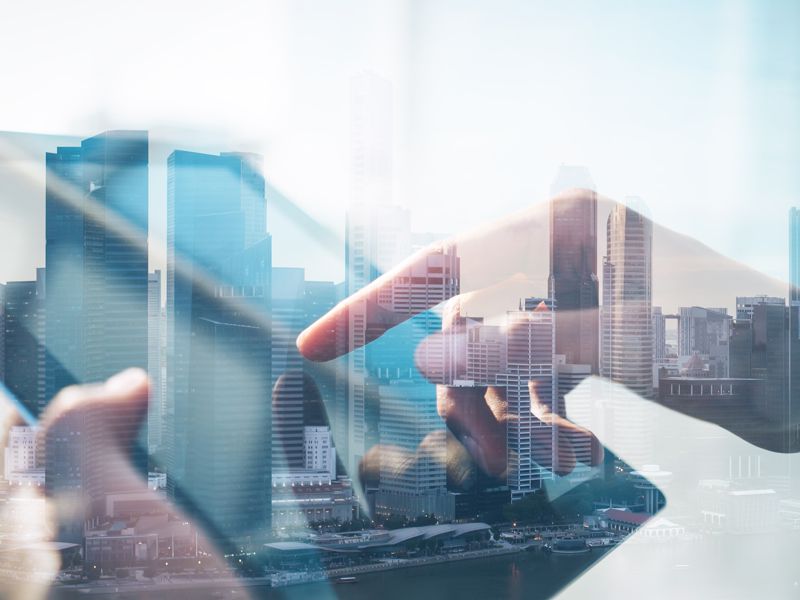 Image of cityscape and digital tablet