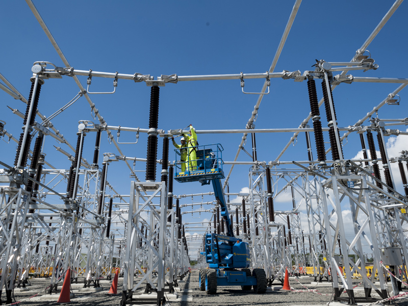 Amey employees in PPE, working at height.