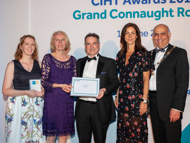 Group image of Amey employees holding an award.