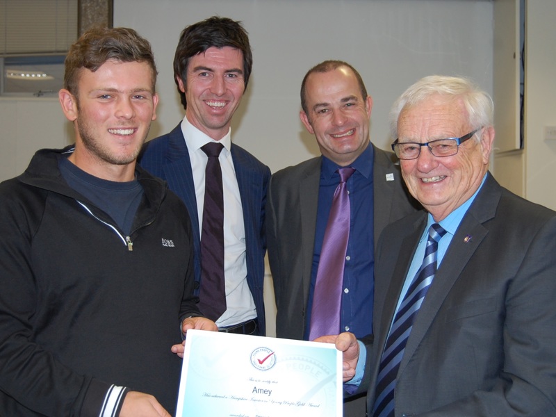 Four Amey employees, holding a certificate.