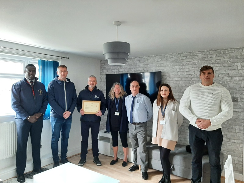 Group image of Amey employees holding a certificate.