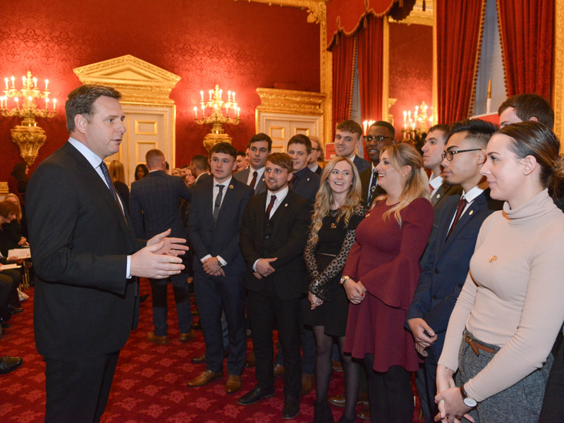 Andy Milner congratulates the award winners at St James's Palace