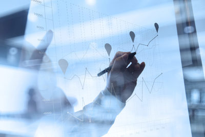 Image of graphic charts being written on a board.