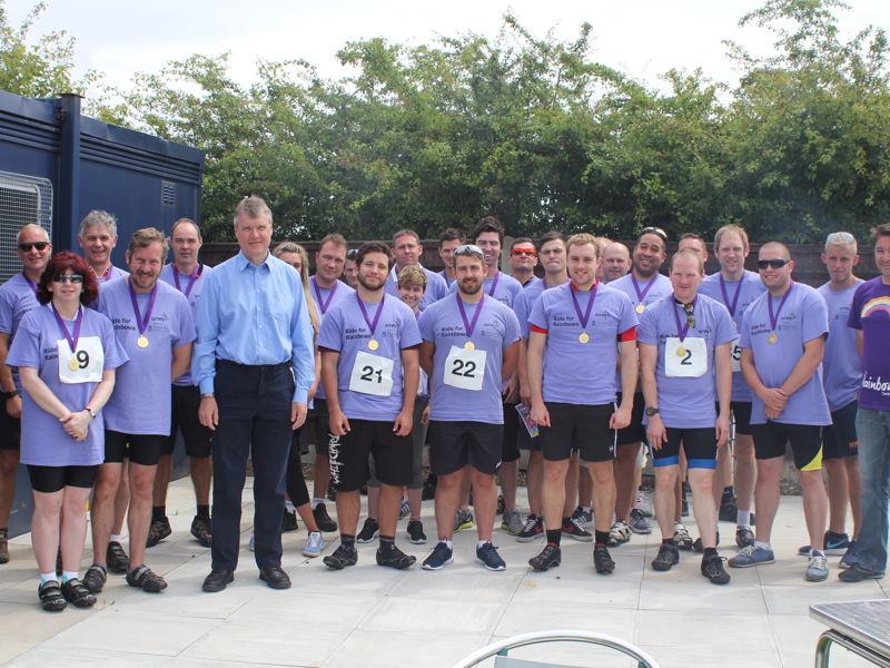 councillor sean woodward and james mudie from the rainbow centre with the cyclists