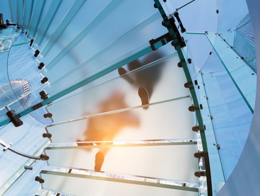 Image of people walking up stairs in a building