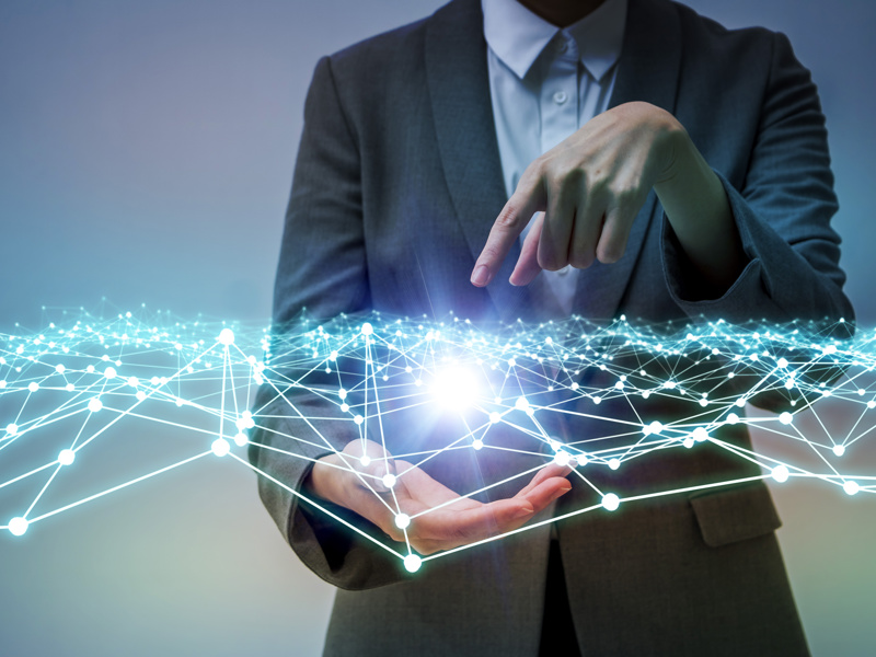 Man pointing at an electric field in the palm of his hands