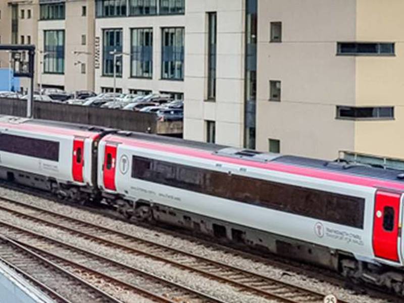Image of a train in front of a building