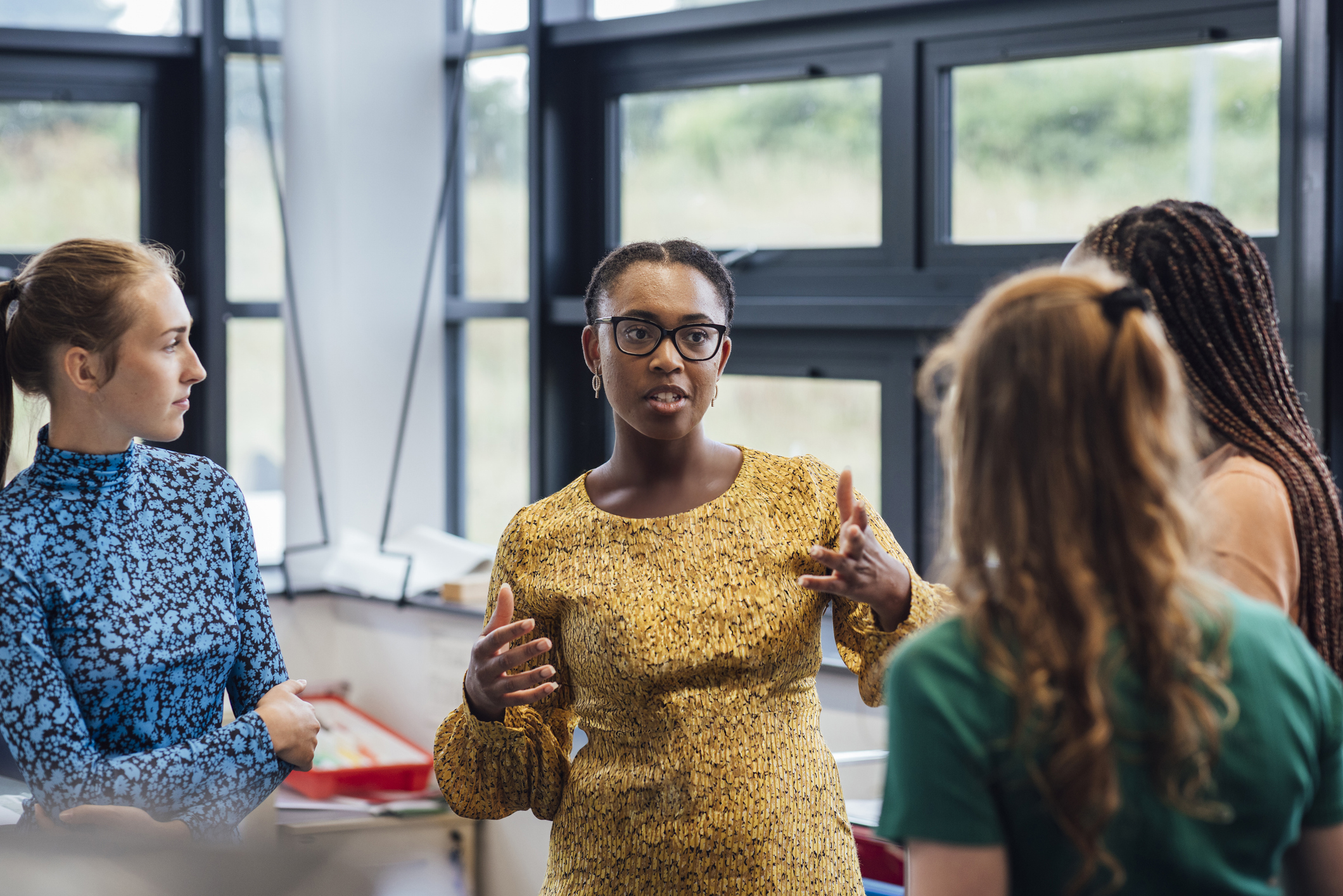 Female speaker leading a workshop in an office setting