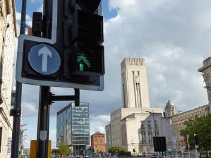 Image of card passing through a traffic light.