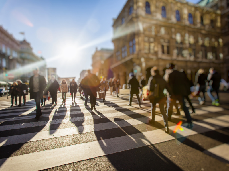 People walking across a zebra crossing