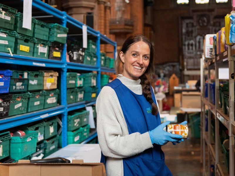 A volunteer helping at a food bank.