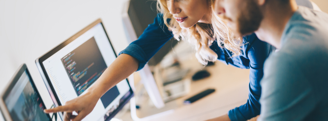 Male and female working at a computer