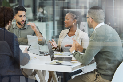 Image of team collaborating at an office desk