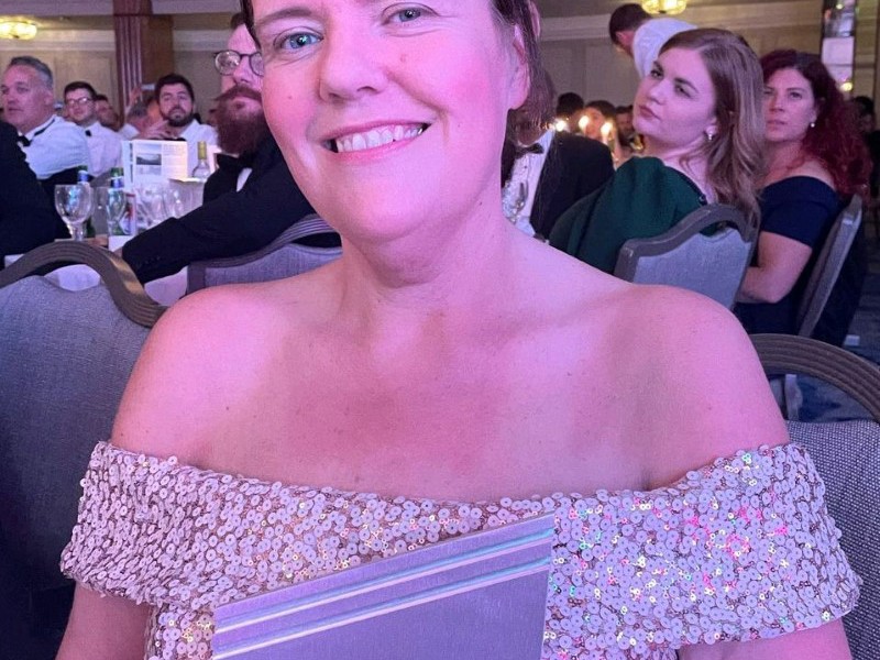 Image of Amey employees in formal attire at an event.