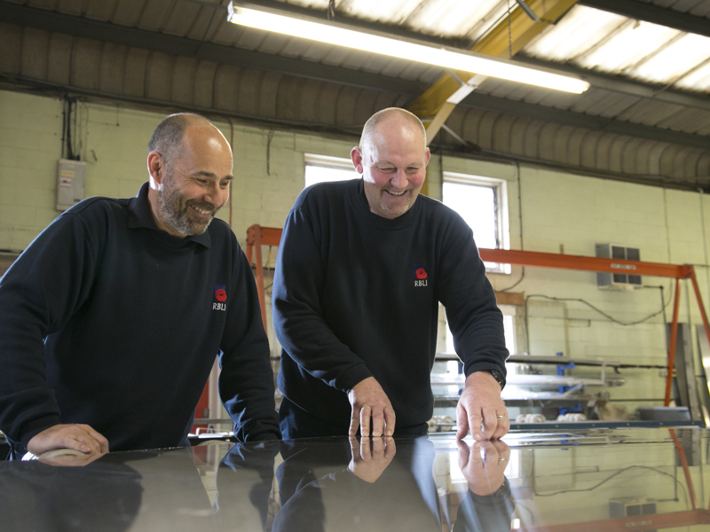 Two men wearing RBLI attire.