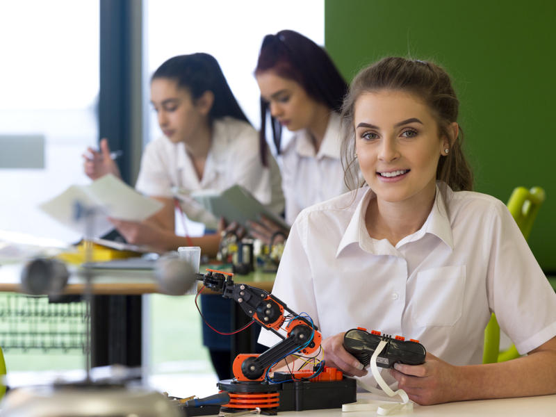 Image of school children working on STEM projects.
