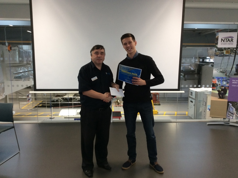 Two Amey employees, holding a certificate. 