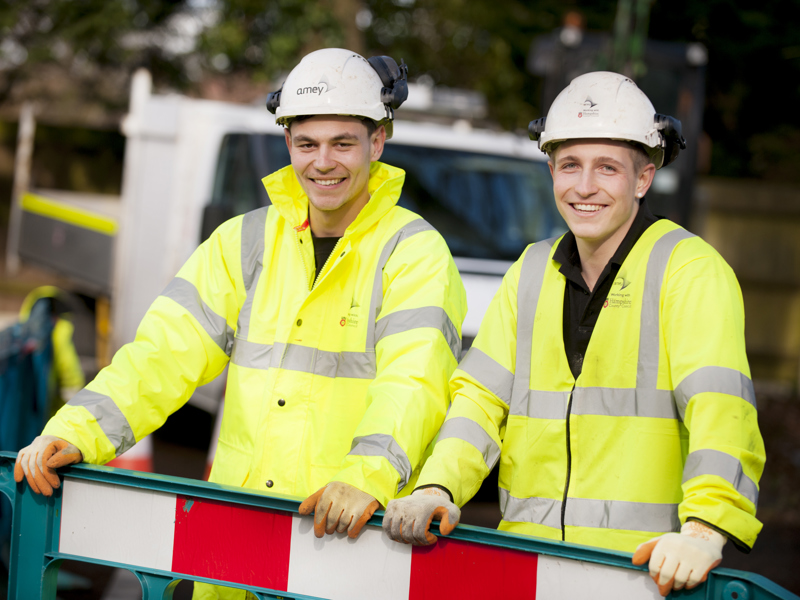 two male Amey employees wearing PPE.