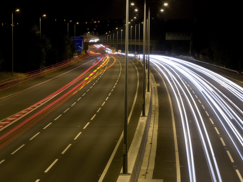 Image of a highway at night.