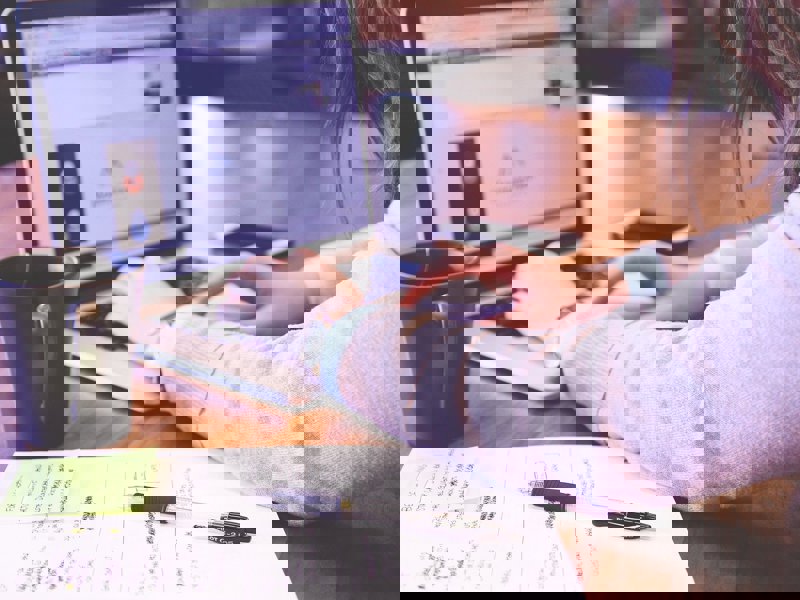 woman working at a laptop.