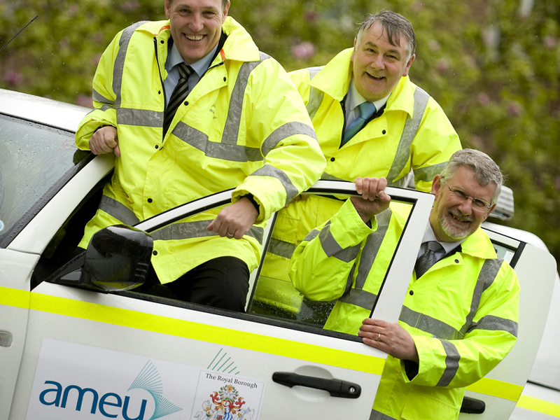 Three men in Amey PPE, exiting a vehicle. 